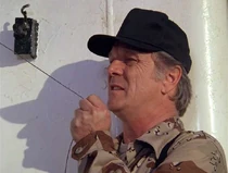 Raymond Mayo as Hansen, a F.I.R.M. security man.