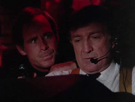 This hijacker is threatening the captain of the flight with his HK4. The square cut muzzle can be clearly seen.