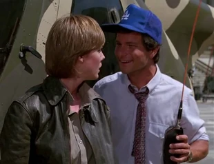Carlson congratulating an upset Caitlin for giving him the best stunt flying he has ever seen.