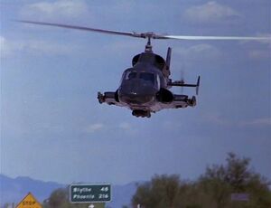 Airwolf comes in low towards the County jail. The road sign says Blythe 46 or 48, Phoenix 216. This should help identify the filming location. Somewhere on Interstate 10 in California.