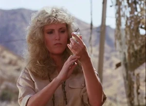 Tanya prepares to inject a truth drug into Hawke.