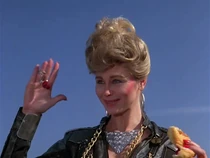 Dolores-Santinis millions.jpg (45 KB) Dolores, an actress on the film set, trying to chat up the newly rich Dominic. She is offering him the "keys" to her "chains".