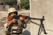 Iraqi solider with RPK with 40-round magazines