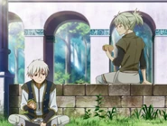 Atori and Zen share a sandwich.