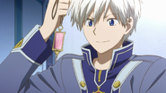 Zen looking at Shirayuki's new ID tag.