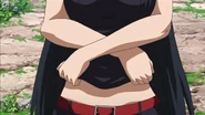 Akame pulling up her shirt to show Tatsumi her belly button
