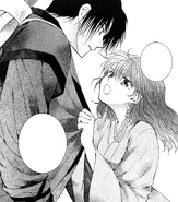 Hak held by Yona as she demands to give himself to her