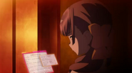 Megumi reading some files.