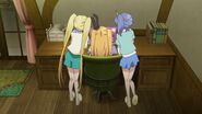 Yuka, Sonata and Makoto looking at an e-mail.