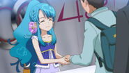 Chieri shaking a fan's hand.