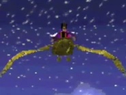 The Evil Sultan flies around The Ancient City with The Real Sultan of Agrabah behind him taking to Nasira Jafar's sister.