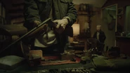 Sam takes his shotgun.