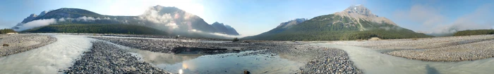 360° panorama of Mount Amery and the Alexandra River in the Icefields Parkway of Jasper and Banff national parks. Low clouds drift along as the morning sun rises over Mount Wilson.