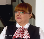 Queta Gibbs (asistente de Anita)