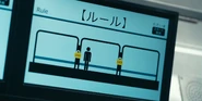 A monitor showing a player between train cars that are locked