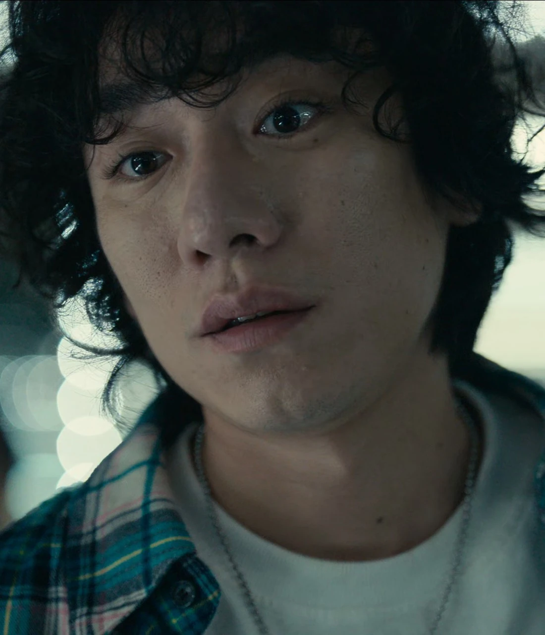 A close-up of Ikeno with a slightly worried and uncertain expression