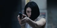 Ann shooting at Isao Shirabi in order to protect Kuina