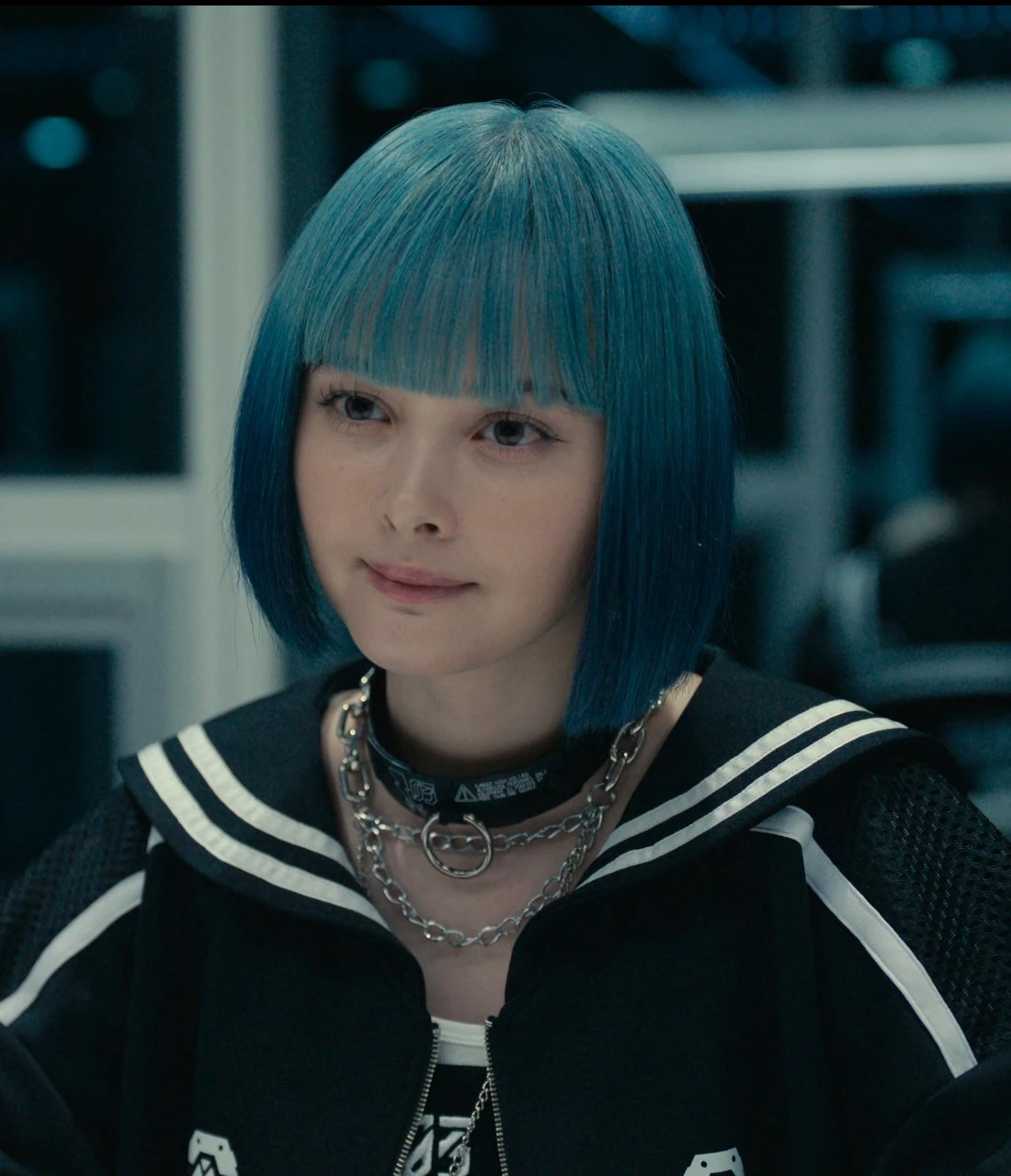 A close-up shot of Rei with an interested look on her face