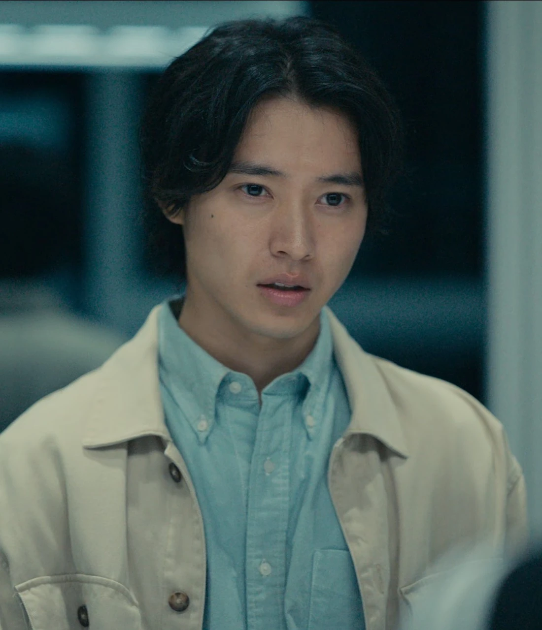 A close-up shot of Arisu wearing a classic beige suit