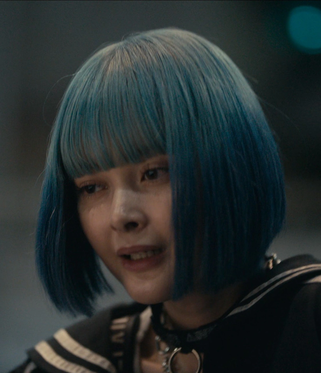 A close-up shot of Rei, looking exhausted and relieved