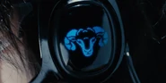 A close-up shot of the headphones on Arisu's head, displaying a blue pixelated sheep icon on the outer side