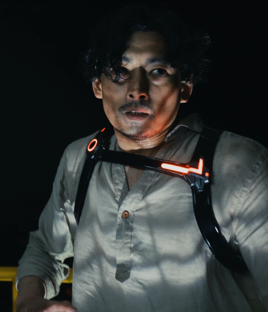 A screenshot of Shingo from Season 2, a sweaty man with short black hair wearing a long-sleeved white shirt