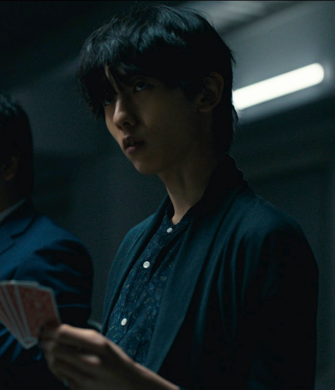 A screenshot of an unnamed player from Season 3, a young man with short black hair, wearing a classic shirt