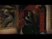 The Mock Turtle is seen at the left of the Knave of Hearts as he comes in.