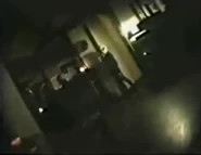 An alien stares at the camera before the video ends.
