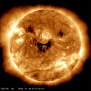 An image taken by NASA showing the Sun smiling. It's a problem for Earth since it could signal a solar storm.