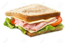 13417289-big-sandwich-with-ham-cheese-tomatoes-and-salad-on-toasted-bread.jpg