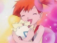 BecauseMistyLovedTogepi 8421.jpg (20 KB) A girl and her partially-unhatched star-shaped baby. Misty/Kasumi and Togepi from Pokémon.