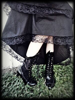 Madam Morbid of Madam Morbid's Favorite Victorian style boots