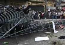 Riot police quell an attempted protest in Macau.