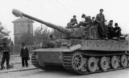 A German tank crew takes time to relax and write letters in France.