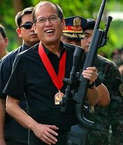 Aquino iii with a gun