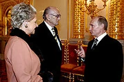 Grand Duke Dimitri (in the center) and his wife Dorrit at a reception with prime minister Vladimir Putin.