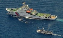 The March 29, 2014 resupply mission. A Philippine government vessel being followed by a larger China Coast Guard vessel.