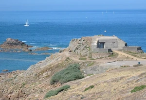 A WWII-era bunker in . Like many of the country's naval defenses, it was started during the brief Vichy control of the islands; though this bunker was not completed until the Free French occupation which followed.