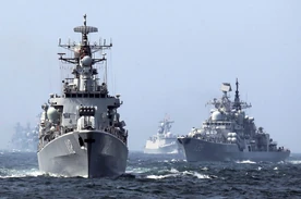 A Chinese vessel tailing a Japanese Destroyer.