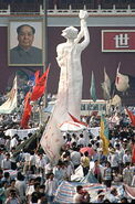 Goddess of Democracy Statue infront of Mao's portrait.