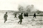 German soldiers marching through the open during the opening actions of Barbarossa.