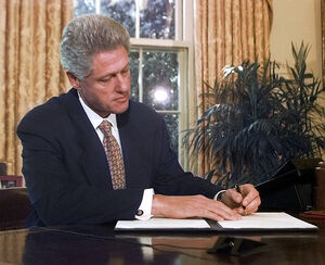 Bill Clinton sigining law.jpg