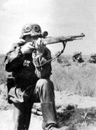 A German sniper takes aim outside Warsaw.