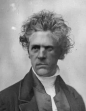 Jack Cain, Rädelsführer der einheimischen Verbrecherbande Undeath Killaboyz in Henrytown † 1880