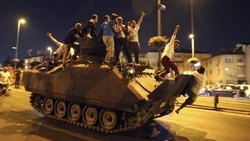 Protesters hijack a pro-royalist tank.