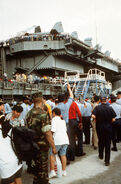 Evacuees from Mount Pinatubo board the USS Abraham Lincoln