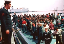 Uruguayan sailors and the Uruguayan Red Cross helping and coordinating the Italian refugees for going to the nearest medical centre for any exposion to radiations.