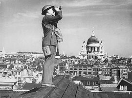 33 Aircraft spotter on a London rooftop