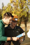 Tyler & Korey reading the clue for Roadblock in Leg 1.